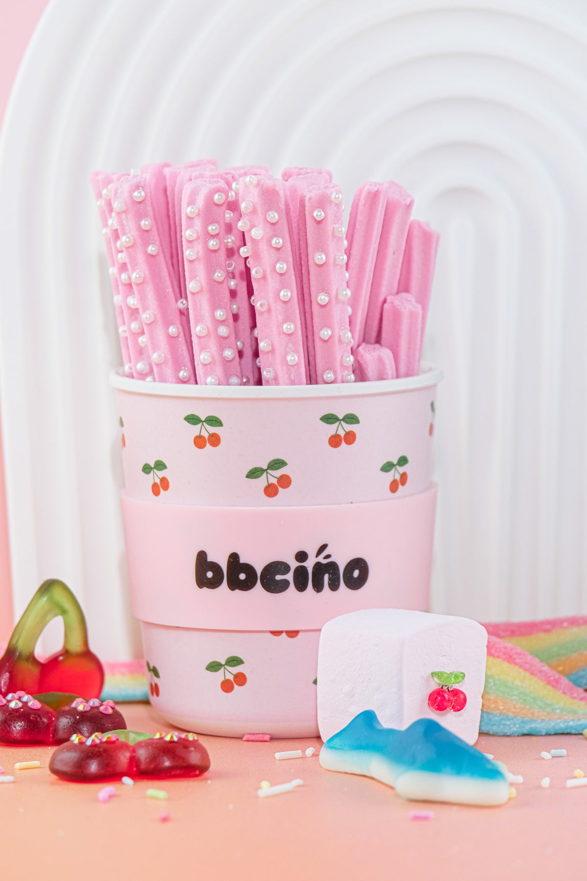 Cherry BambinoCino cup filled with pink straws
