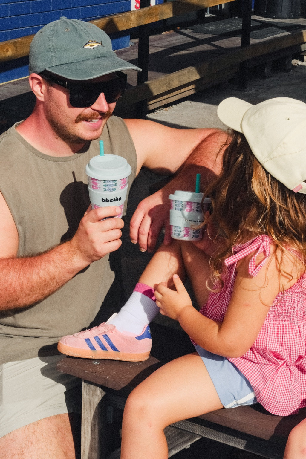 Dad and daughter enjoying matching BBcino cups