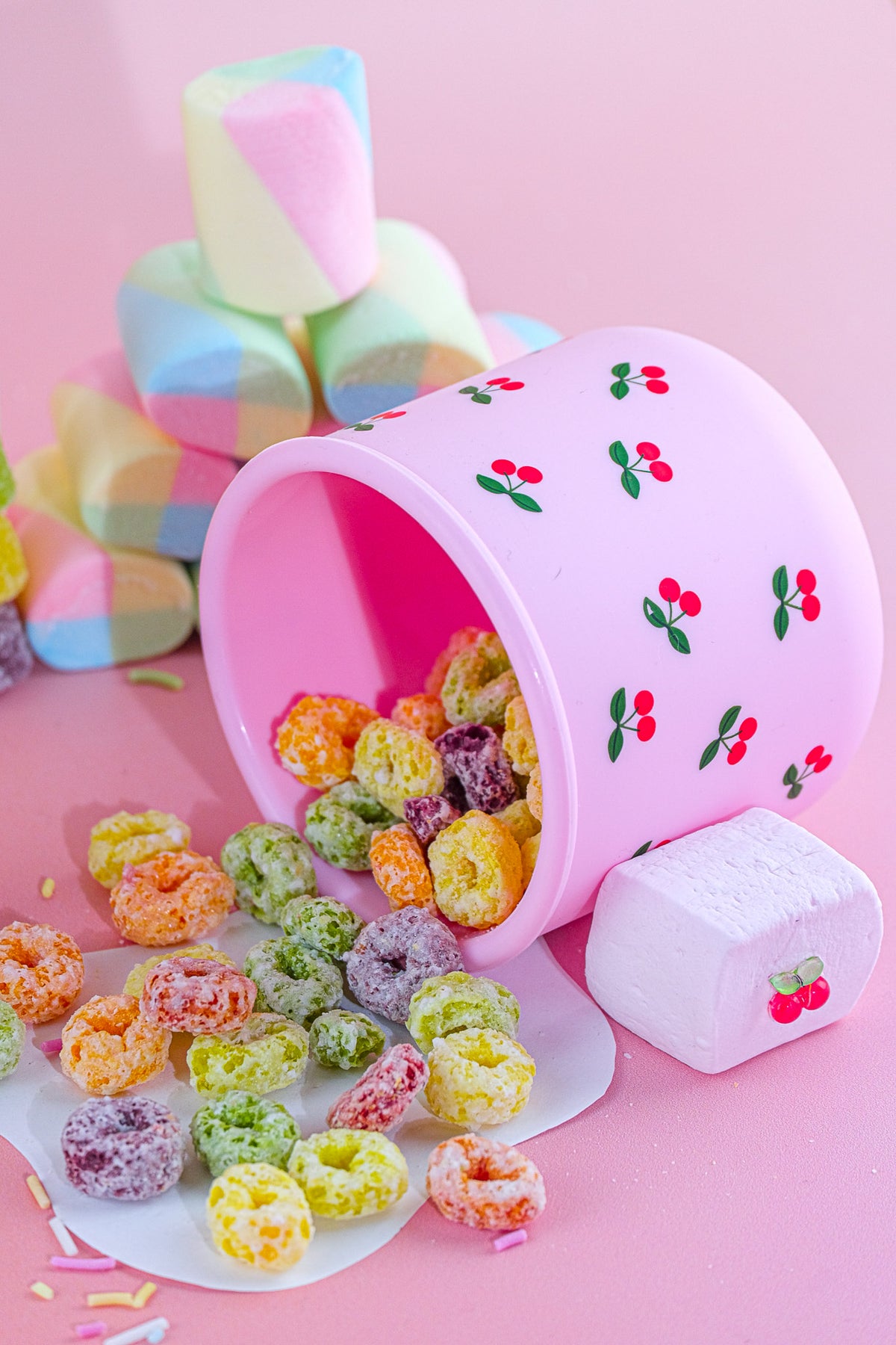 Cherry reusable snack pot with colourful cereal and marshmallows